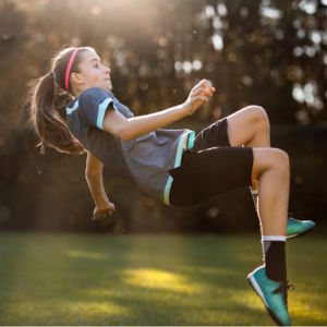 A girl playing soccer